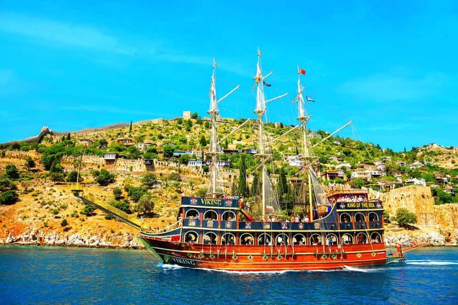 Alanya: Biggest Pirate Boat Tour with Soft Drinks and Lunch - Kleopatra Beach: photo stop, swimming time, and dolphin watching