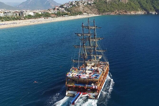 Alanya Catamaran Boat Tour with Lunch, Soft Drinks & Transfer - Kleopatra Plajı Swim Breaks, Snorkeling Time, and Lunch at Sea