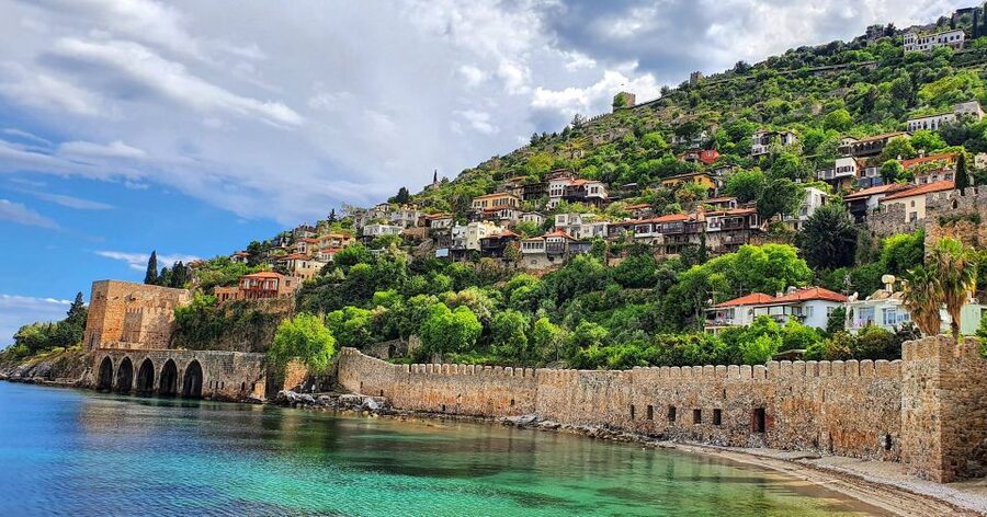 Alanya: Catamaran Boat Trip with Sunbathing and Swimming - The cruise views: shipyard, Red Tower area, and sea caves from the boat