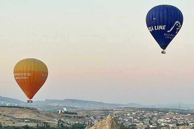 Cat Valley Ballon Tour In Cappadocia With Free Hotel Transfer - The Cat Valley flight, sunrise light and rock formations below