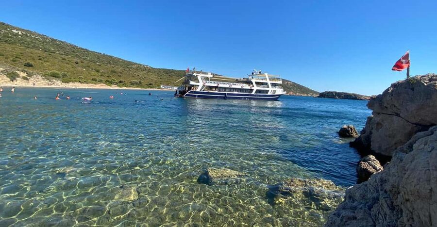 Cesme: Islands and Bays Boat Trip with BBQ Lunch - The two later stops that change with weather: Coral, Paradise, Winter, and Macri