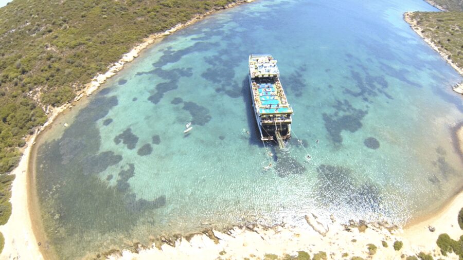 Cesme: Islands and Bays Boat Trip with BBQ Lunch - Getting there at the dock: Cesme Castle to the PTT meeting spot