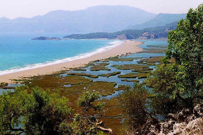Full Day Turtle Beach Tour With Lake and Mud Baths From Marmaris - The boat ride along Dalyan: calm water, tomb sightings, and a crab-assisted turtle tip