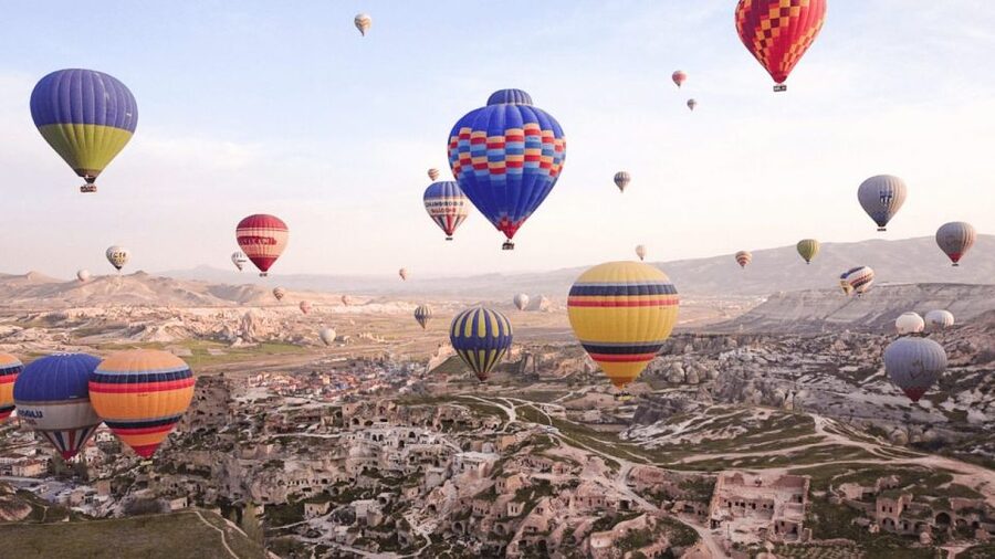 Göreme: Sunrise Hot Air Balloon Flight Over Cappadocia - Flying over fairy chimneys and tuff valleys at sunrise