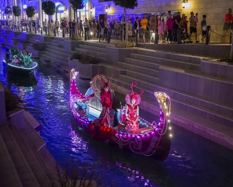 The Land of Legends Night Show & Shopping Avenue - Acrobats, dance energy, DJ moments, and jetpack-style segments